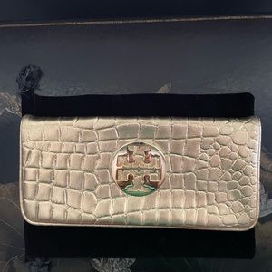 Tory Burch gold clutch